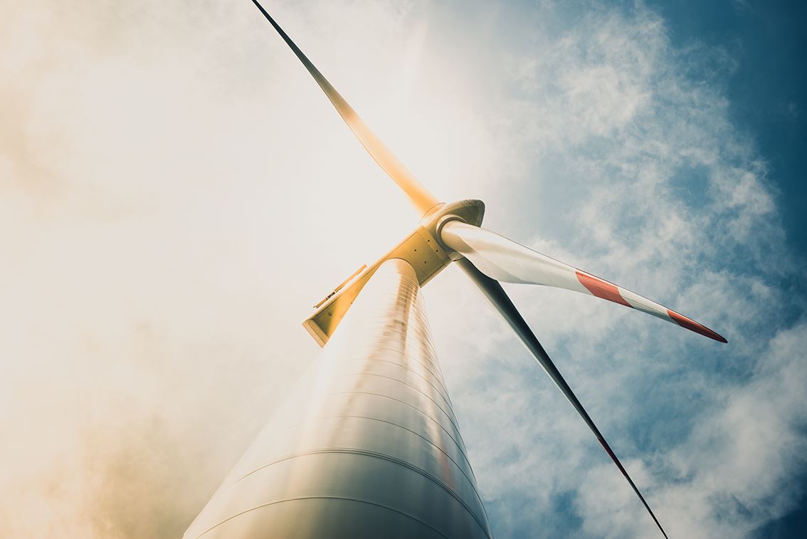 Large-wind-turbine-with-clouded-sky.jpg